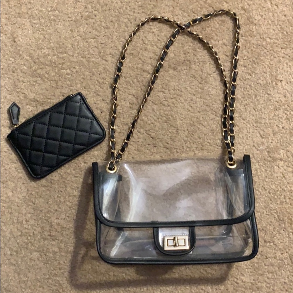 Clear purse with black and gold straps